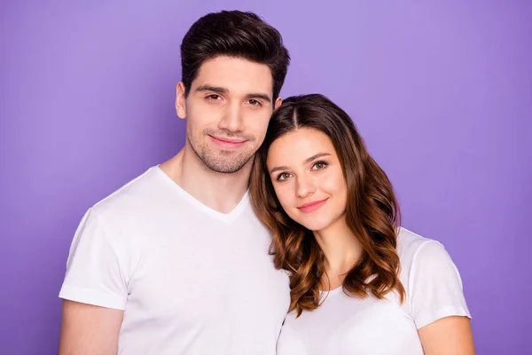 Portrait of peaceful trust beloved married students couple enjoy togetherness look in camera wear stylish clothes isolated over purple color background — Stock Photo, Image