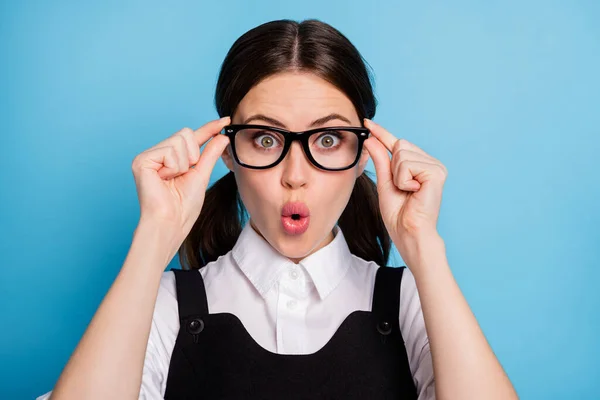 Close-up portrait of her she nice attractive pretty amazed brainy knowledgeable cheery schoolgirl nerd geek touching glasses pout lips isolated bright vivid shine vibrant blue color background — Stock Photo, Image