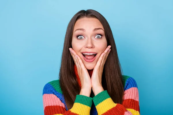 Portrait of astonished crazy positive girl impressed incredible novelty touch hands face cheeks wear good look style stylish trendy jumper isolated over blue color background — Stock Photo, Image