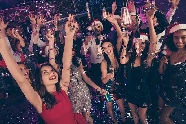 Photo of crazy attractive people raise hands illumination rejoice hold glass champagne dance floor modern club indoors — Stock Photo, Image