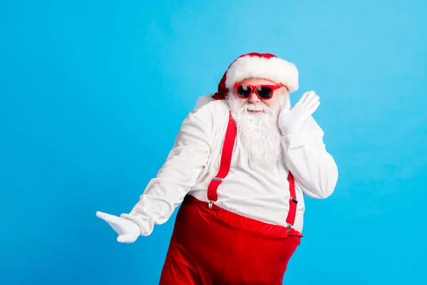 Foto de funky fat santa claus dance x-mas christmas newyear fairy party wear overall suspenders style trendy cap isolated blue color background — Foto de Stock