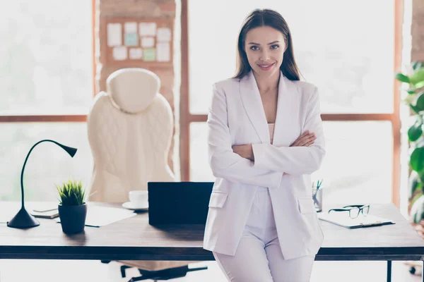 Photo of attractive beautiful business lady hold arms crossed self-confident person friendly smile home spacious office social distance formal wear blazer pants white suit indoors