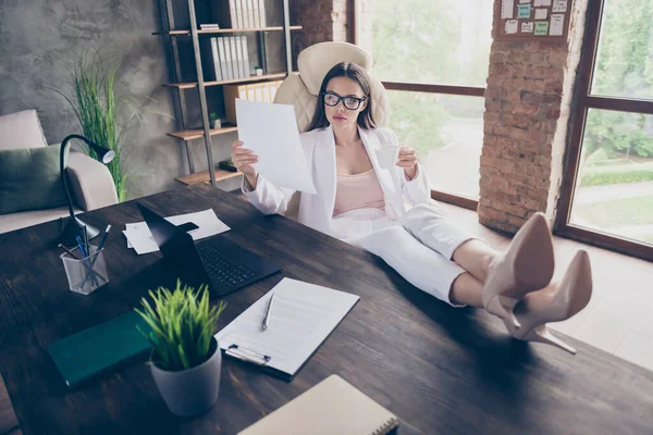 Portrait of her she pretty chic classy busy focused lady specialist drinking tea reading researching corporate law contract agreement at modern industrial loft brick interior workplace workstation — Stock Photo, Image