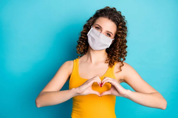 Photo of pretty ginger student girl romantic fingers heart shape wear mask yellow tank-top isolated blue color background — Stock Photo, Image