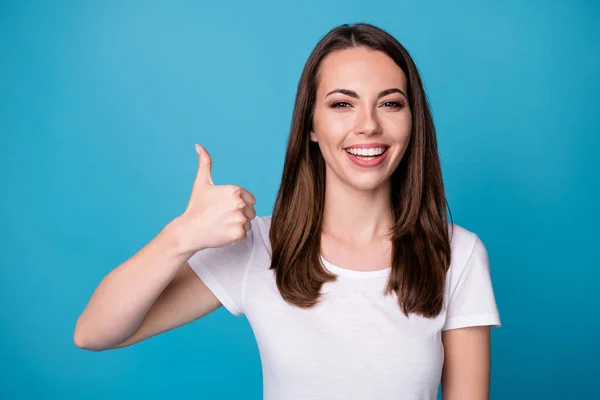 Portrait of positive cheerful girl enjoy rejoice perfect ads promo showing thumb up sign wear good look clothes isolated over blue color background