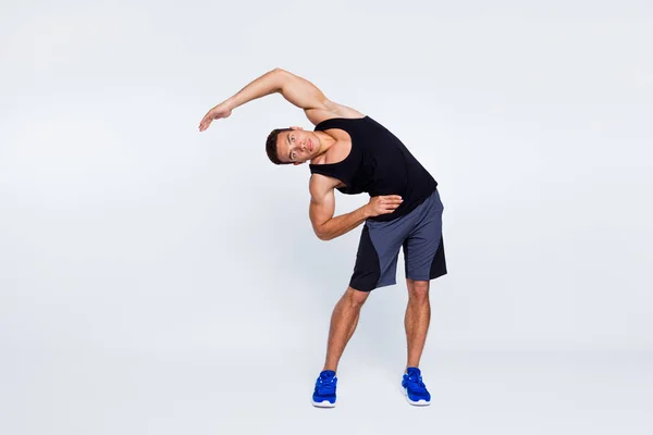 Full length body size view of his he nice attractive focused sportive guy doing inclines stretching pilates isolated over light gray pastel color background — Stock Photo, Image