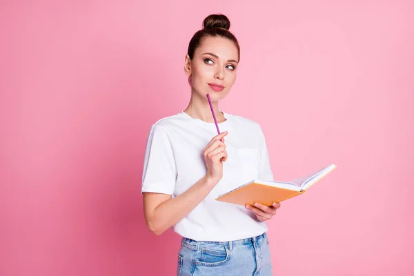 Photo of curious smart girl write copybook touch chin pencil look copyspace think thoughts decide project decision wear white t-shirt denim isolated over pastel color background — Stock fotografie
