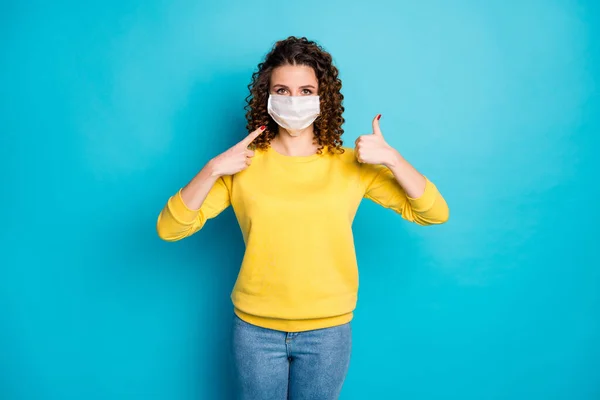 Portrait of her she nice attractive wavy-haired girl wearing showing safe mask medicine measures sars covid19 decontamination thumbup isolated on bright vivid shine vibrant blue color background — Stock Photo, Image