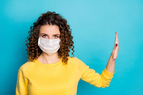 Close-up portrait of nice attractive conscious serious wavy-haired girl wearing safe medical respiratory mask showing no sign aside sars isolated on bright vivid shine vibrant blue color background — Stock Photo, Image