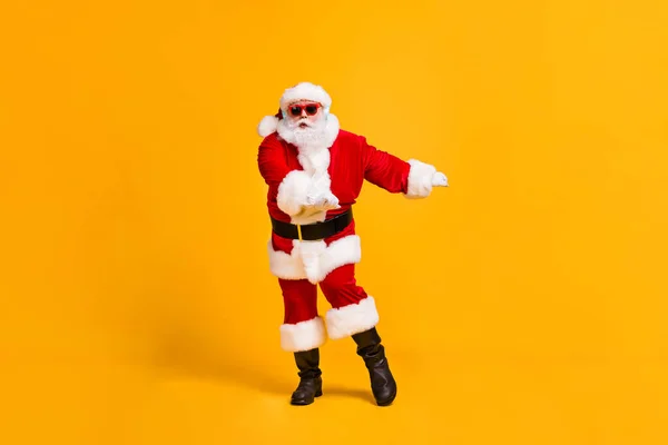 Full size photo of funky fat santa claus listen x-mas christmas music wireless headset dance newyear disco wear sunglass headwear cap isolated bright shine color background — Stock Photo, Image