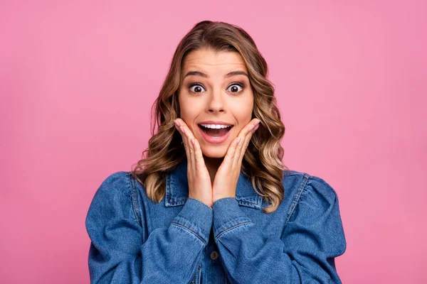 Portrait of astonished girl touch hands face scream isolated over pastel color background