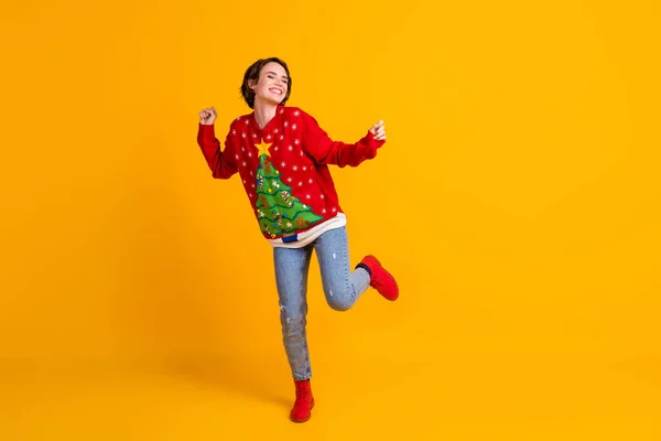 Foto in voller Größe von crazy funky girl dance x-mas newyear party wear christmas tree decor jumper jeans boots isolated over bright shine color hintergrund — Stockfoto