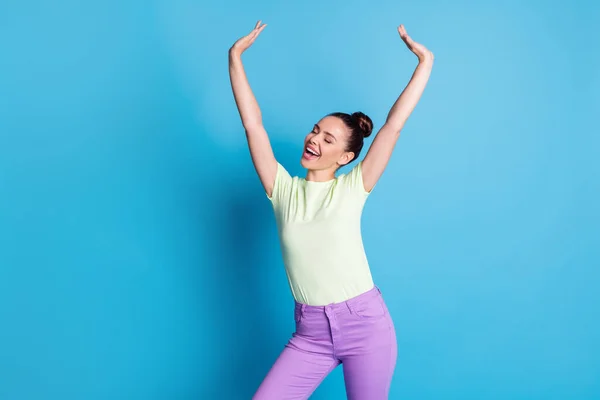 Photo of excited girl raise hands up wear casual clothes isolated over blue pastel color background — Stock Photo, Image
