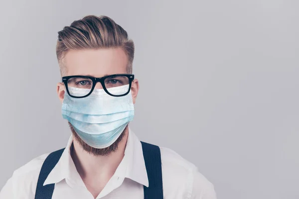 Close up portrait of handsome guy in blue face mask isolated on gray background — Stock Photo, Image