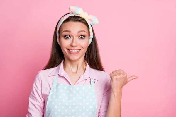 Portrait of positive energetic girl point thumb copyspace suggest select incredible adverts promotion wear dotted shirt isolated over pastel color background — Stock Photo, Image