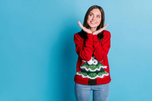 Photo portrait of dreamy girl planning winter holidays holding hands near face wearing ugly christmas sweater tree googly eyes isolated on pastel light blue colored background with blank space — Stock Photo, Image