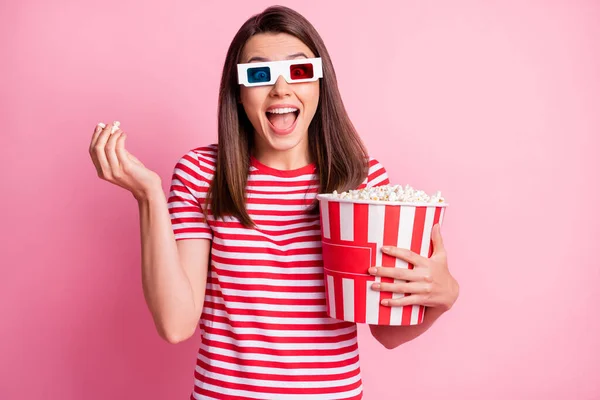 Portrait of nice attractive girl eating corn watch film having fun wear glasses t-shirt isolated on pink color background — Stock Photo, Image