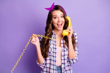 Photo of pretty girl hold telephone open mouth play wire wear checkered shirt vintage headband isolated violet color background clipart