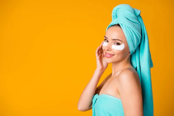 Side profile photo of young beautiful smiling woman girl look in camera with eye patch isolated on yellow color background