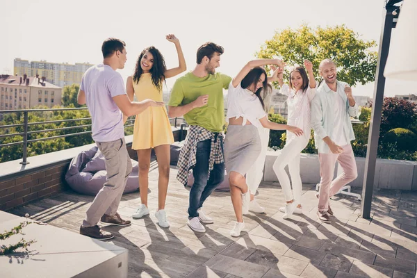 Photo of friendly pretty girls handsome guys have fun dancing party on roof terrace outside