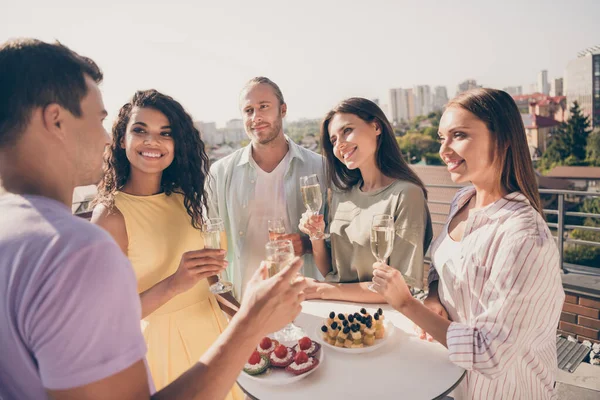Photo of smiling positive happy delighted good mood friends celebrate birthday drink champagne outside on rooftop — Stock Photo, Image