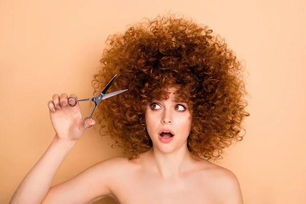 Close-up portrait of nice cute attractive confused frustrated afraid wavy-haired girl cutting dry split ends curls pampering body bodycare oops mistake correction isolated over beige pastel background — Stock Photo, Image