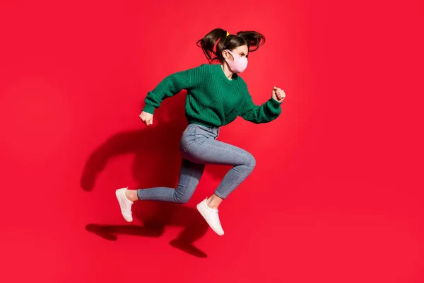 Adatlap side photo of trendy brunette tails girl jump run empty space wear farmer zöld jumper mask isolated on red color background — Stock Fotó