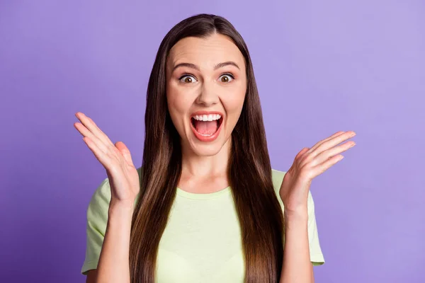 Photo of attractive lady arms palm open mouth scream yeah light green outfit isolated on violet color background — 图库照片