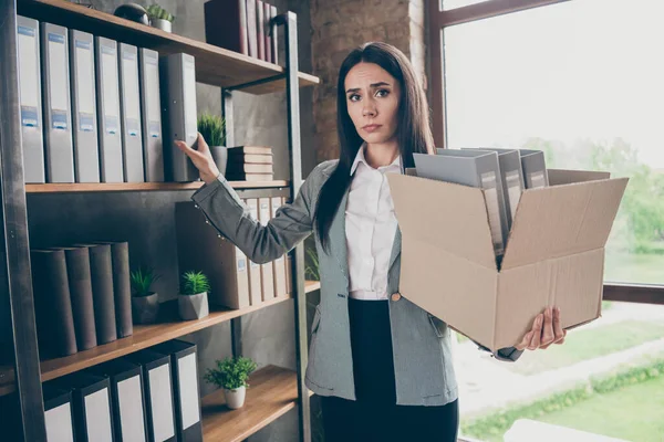 Photo of frustrated girl marketer lawyer lose company covid corona virus economics crisis collect folders hold cardboard box wear suit blazer jacket in loft office — Stock fotografie