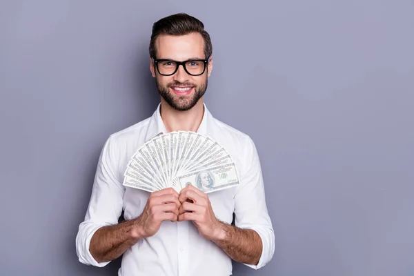 Close-up portrait of his he nice attractive successful confident man holding in hands bunch usd exchange salary savings budget isolated over grey violet purple pastel color background — Stock Photo, Image