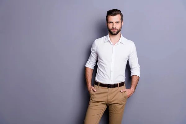 Portrait of reliable minded executive representative marketer man put hands trousers look classy attract charming woman wear white clothes isolated over gray color background