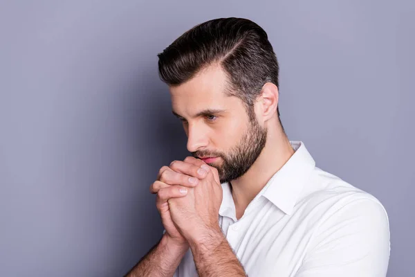 Profiel side photo of minded pensive guy wait job vacature decisions touch fist together kin look copyspace wear white trendy shirt isolated over grey color background — Stockfoto
