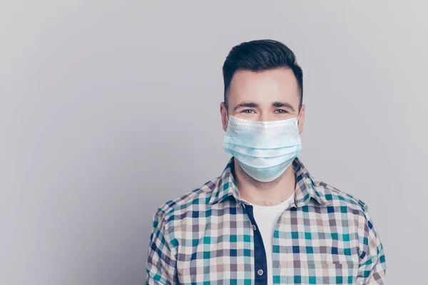 Close-up portrait of nice content guy wearing safety gauze mask mers cov prevention copy space isolated over grey background — Stock Photo, Image