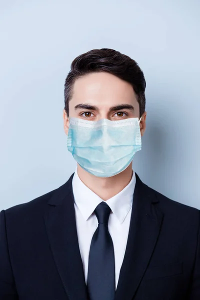 Vertical close-up portrait of classy expert guy wearing gauze safety mask disease prevention isolated on blue color background — Stock Photo, Image