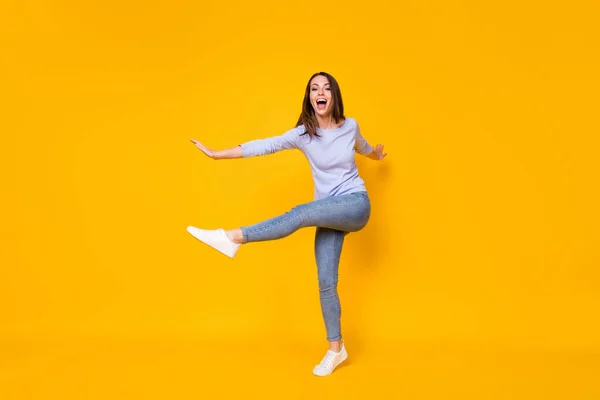 Full length body size view of her she attractive pretty funky ecstatic slender cheerful cheery girl jumping having fun good mood dancing isolated bright vivid shine vibrant yellow color background — Stock Photo, Image