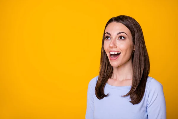 Photo of astonished positive cheerful girl look copyspace impressed wonderful bargain novelty ads wear shirt isolated over bright color background — Stock Photo, Image