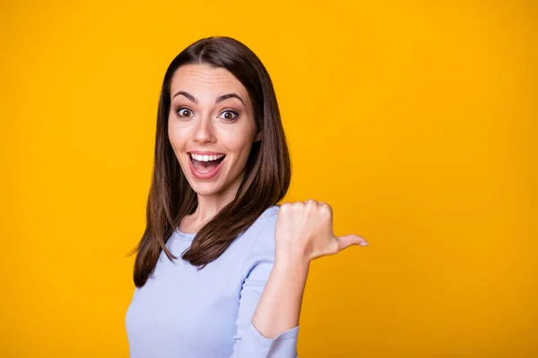 Photo of excited crazy girl impressed incredible ads promotion point forefinger copyspace wear good look shirt isolated over bright shine color background — Stock Photo, Image