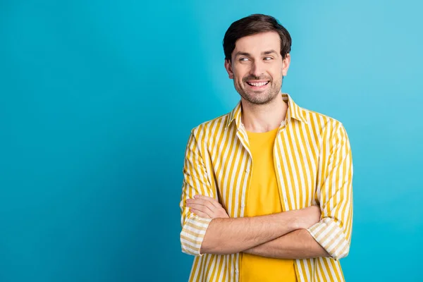 Photo of glad smart guy look copyspace cross hands enjoy business travel wear striped shirt isolated over blue color background — Zdjęcie stockowe