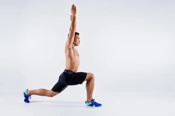 Full length body size profile side view of his he nice attractive sportive guy doing sit-up rising hands up pose position shaping pilates yoga isolated over light white pastel color background — Stock Photo, Image