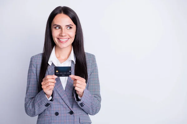 Photo of attractive business lady good mood plastic debit credit card advice new online transfer retail system service look interested empty space formalwear isolated grey color background — Stock Photo, Image