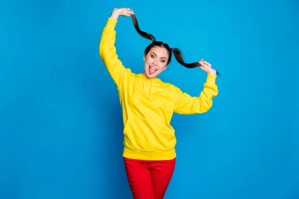 Portrait of her she nice attractive lovely pretty childish cheerful cheery girl making tails having fun leisure showing tongue isolated over bright vivid shine vibrant blue color background — Stock Photo, Image