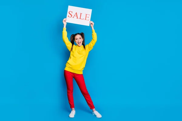 Full length body size view of her she nice attractive pretty cheerful cheery glad girl demonstrating placard word sale advice ad isolated over bright vivid shine vibrant blue color background — Stock Photo, Image