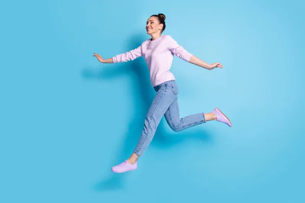 Full length body size profile side view her she nice-looking attractive pretty lovely feminine cheerful cheery girl jumping running enjoying isolated bright vivid shine vibrant blue color background — Stock Photo, Image