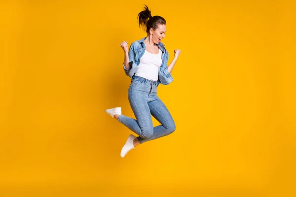 Full length body size view of her she attractive lovely slim fit glad cheerful cheery girl jumping rejoicing having fun attainment isolated bright vivid shine vibrant yellow color background — Stock Photo, Image