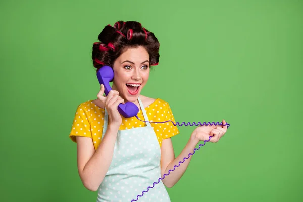 What quarantine canceled. Crazy shocked vintage girl call friend telephone cord impressed news wear yellow dotted dress hair rollers isolated over green color background