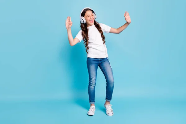 Full length body size view of nice dreamy cheerful wavy-haired girl listening stereo single melody having fun dancing isolated on bright vivid shine vibrant blue teal turquoise color background — Stock Photo, Image