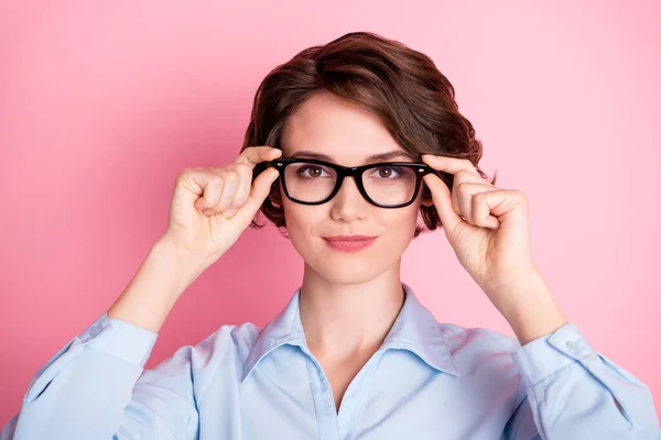 Close-up portrait of her she nice attractive content intelligent brown-haired girl executive assistant expert specialist employee touching specs isolated pink pastel color background