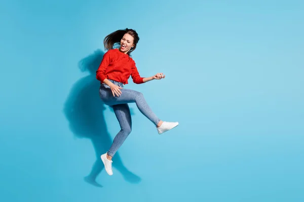 Full length photo of funky crazy lady jump flight play imaginary guitar musician isolated blue color background