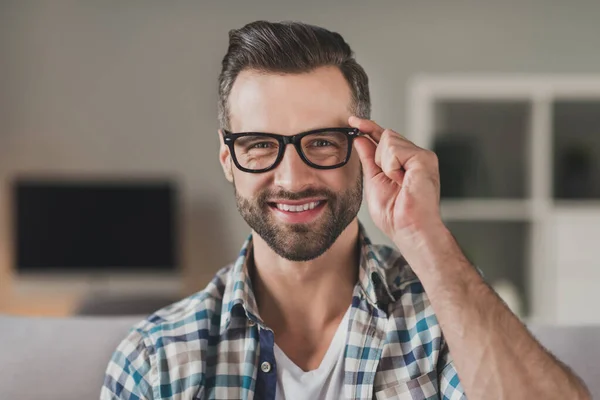 Photo of young handsome cheerful man happy positive toothy smile confident hand touch eyeglasses home — Stock Photo, Image