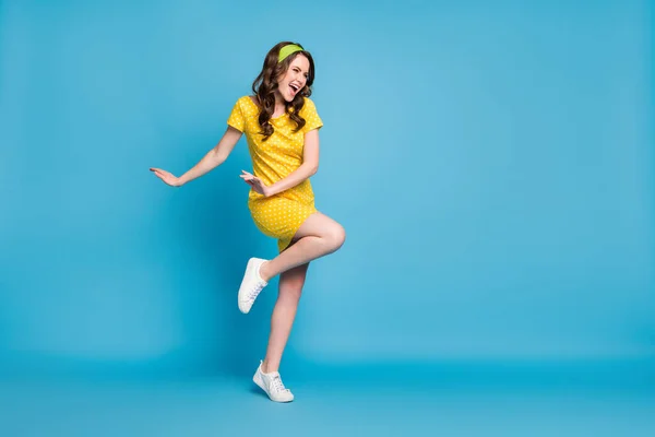 Full body photo of excited lady look in empty space wear polka-dot skirt isolated over blue color background — Stock Photo, Image